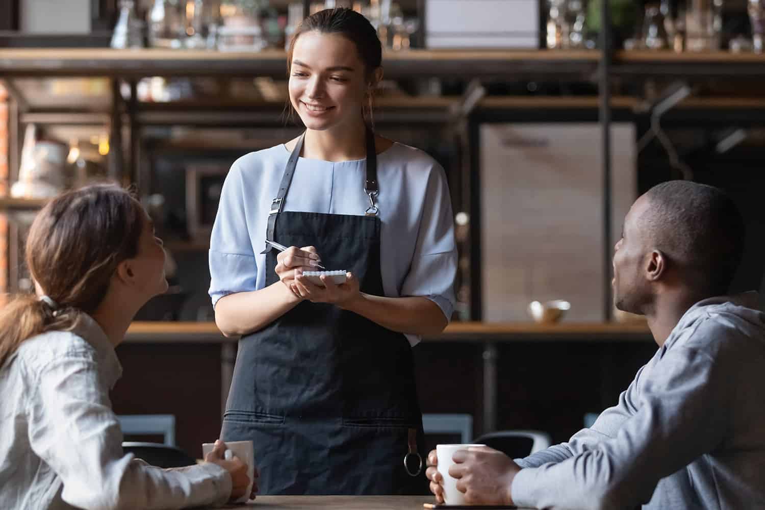 Waitress Taking Order from Couple